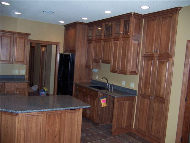 Hickory cabinets - Raised panel doors and side panels - Full overlay style - Quartz countertops